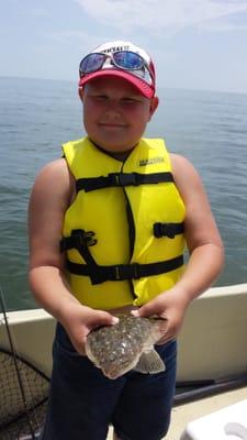 AJ showing off his first flounder