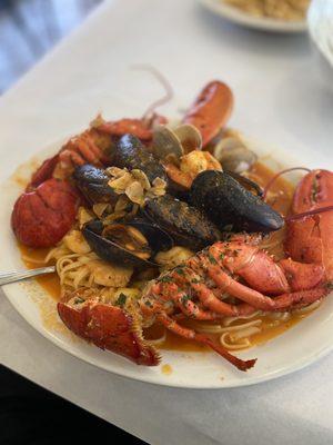 Seafood Mediterranean. shrimp, Scallops, Clams, Mussels & Lobster over Linguini Pasta.