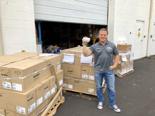 Andy with several hundred CPAP's that just arrived