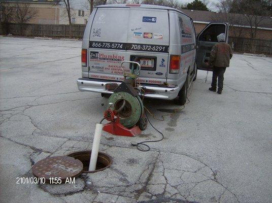 Sewer rodding at a strip mall