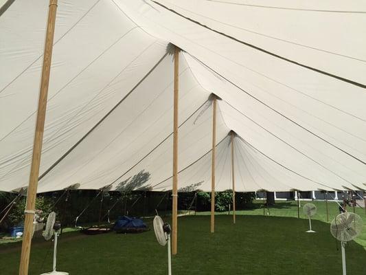 Sailcloth style pole tent. Warm translucent light sets the mood