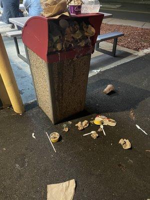 Garbage filled to the top while 6 workers were inside doing nothing.