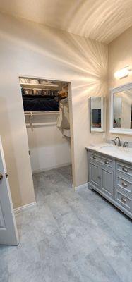 Batroom remodel with new pocket door for easy access to closet.