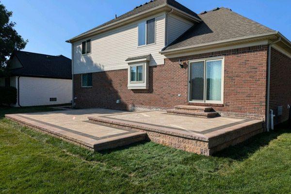 Macomb Twp project. Raised brick paver patio and brick paver walkway.  Retainer wall is Fendt, Keystone Compact Brick is Belg...