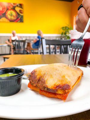 Pork Tamal; You can definitely tell they mixed some of the sauce from the meat into the masa, which is how it should traditionally be.