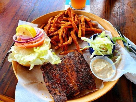 Blackened Mahi sandwich with coleslaw and sweet potato fries.