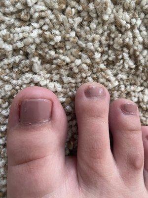 paint left on middle toe - did not clean up job after.