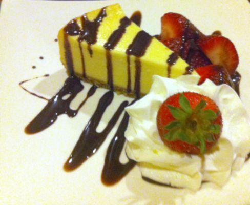 the new York cheesecake with chocolate sauce and fresh strawberries. Only available seasonally