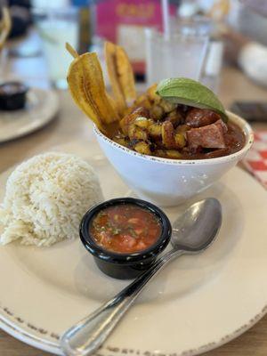 Delicious Cazuela con Frijoles. Rice, beans, pork belly, sausage, plantain chips with rice.