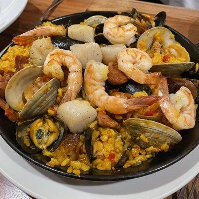 Paella Valencia. Pale shrimp and scallops..no socarrat so not really paella more Spanish risotto than anything. This was a miss for us.