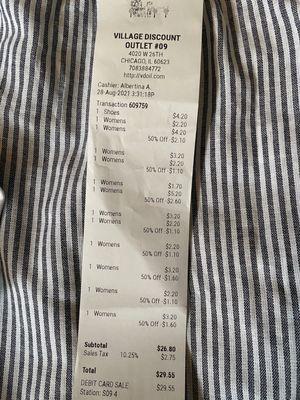 Receipt showing low prices and half-off discount