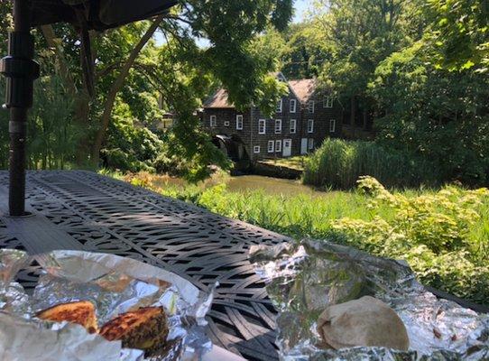 Enjoying lunch on the backyard patio with a view of the Grist Mill