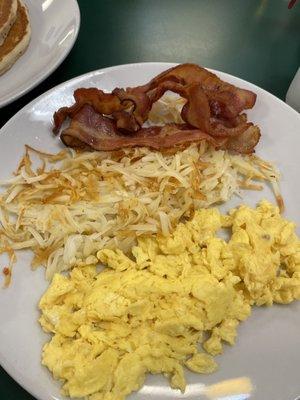 scrambled eggs, bacon, and hash browns