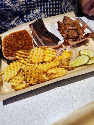 Brisket & Burnt Ends on (the right).  With baked beans and waffle fries.