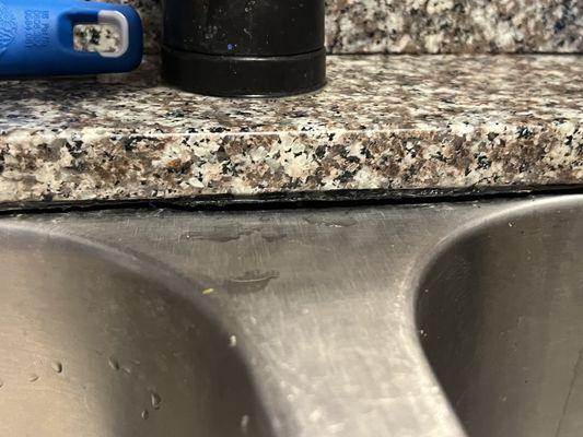 Sink with old and gross caulking