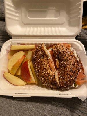 Bagel and Lox Sandwich with a side of apple