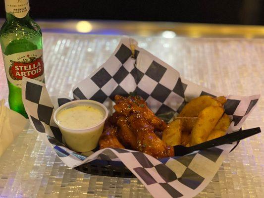 Sweet chili wings and fries. With a beer