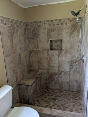 Shower remodel with a bench seat.