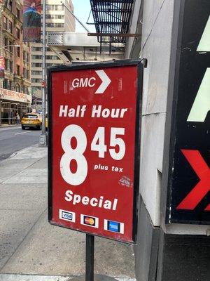 This sign proving that half an hour is $8,45 plus tax