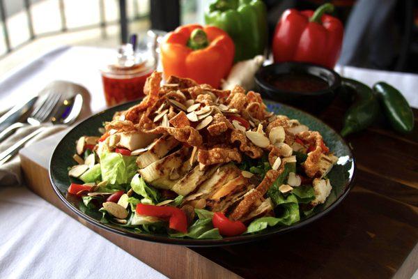 Sesame Chicken Salad:  Chicken breast, wontons, red bell peppers, slivered almonds, and romaine lettuce.