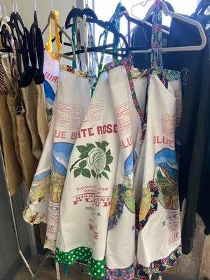 Flour sack aprons for sale, made by a 94 year old local woman