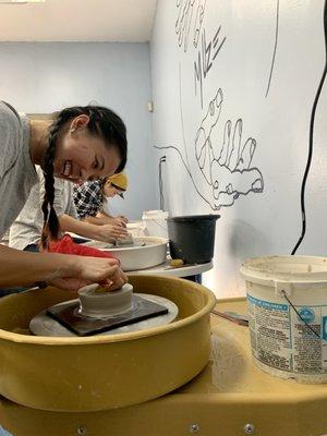 New students at the pottery wheel class!