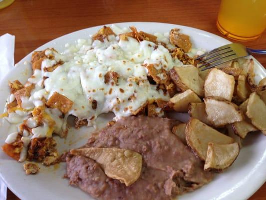 $6.99 Crazy Migas Plate - migas w/ cheese & chorizo + a side of papas y frijoles