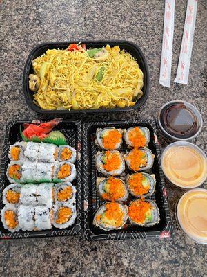 Singapore chicken Noodles. 2 orders of spicy salmon rolls and a village roll. Sauce on side.