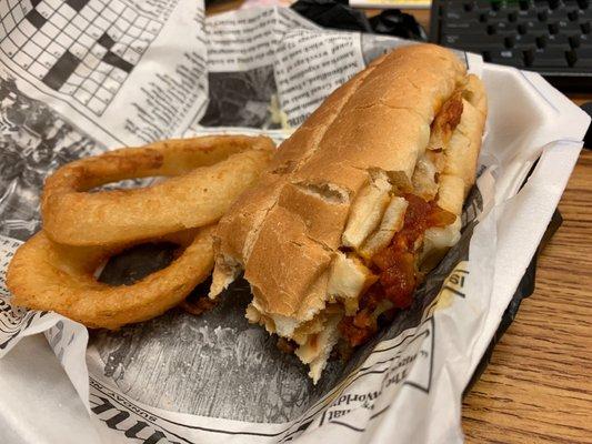 Chicken parmesan sandwich and onion rings. I ate half of it before taking the picture. Lol. It was delicious!