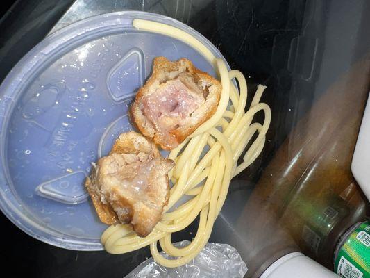 Discolored chicken and spaghetti noodles, chicken looks like it's been cooked for days