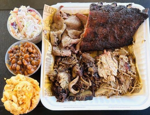 Our meat sampler with tri-tip, brisket, pork, baby back ribs and sides of coleslaw, baked beans, mac & cheese