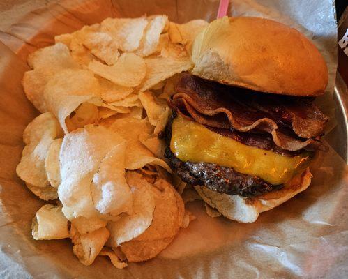 Barrel Burger topped with cheddar cheese, caramelized onions and bacon.