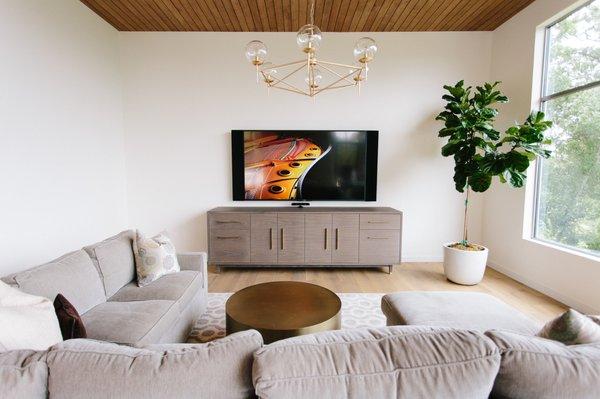 Custom speakers that are made to match the length or width of a TV give an entertainment space a cohesive look.