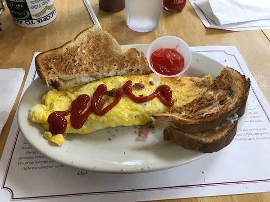 All meat omlette, fresh bread toast and home made strawberry jam