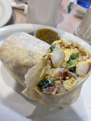 Breakfast burrito with hash green pepper onion bacon spinach pepper Jack cheese a side of their house salsa