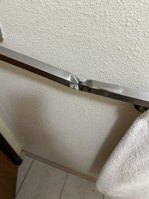 Bent towel rack but it is mighty as it did not pull out of the wall!