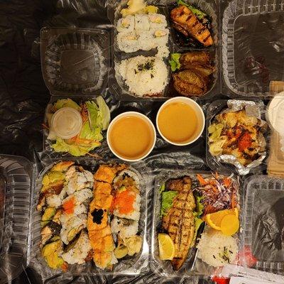 Specialty Rolls, Saba Shioyaki entree (bottom right), Volcano roll  (middle) and Teriyaki Salmon Bento Box