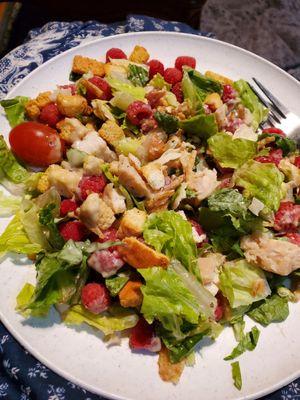 Caesar's Salad with chicken chunks.