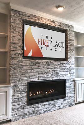 Complete tear out of existing prefabricated fireplace & installation of new linear gas fireplace with ledger stone fascia in Marietta, GA