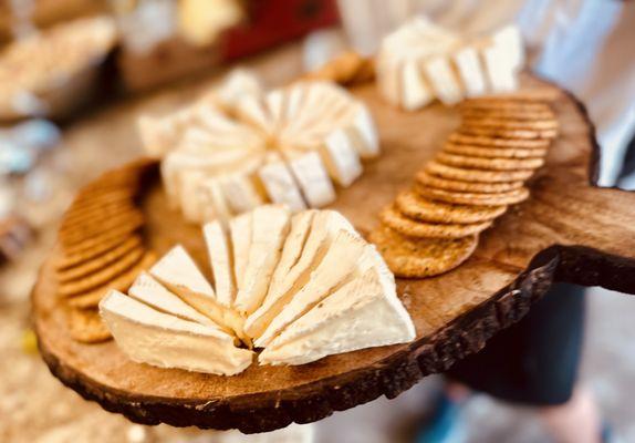 Brie cheese wheels and crackers