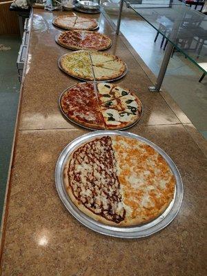 different types of pizza by the slice  Come in and check out our pizza slices served fresh everyday!!!