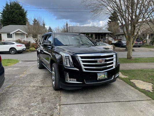 Spotlessly clean Cadillac Escalade with bottles of water ready for us.