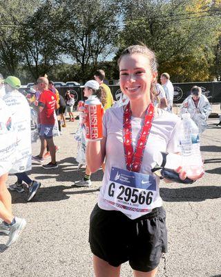 A happy client celebrating a personal record at The Chicago Marathon.