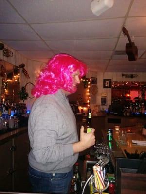 Guest bartender wearing wig from bachelorette party. It's getting weird in here.