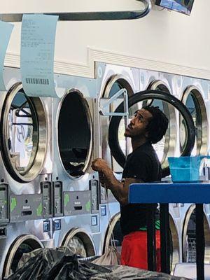 LaundryHeaven customer drying a load while watching TV