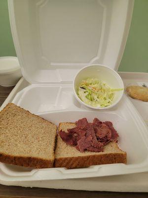 Dried out pastrami on wheat sandwich bread + undressed coleslaw