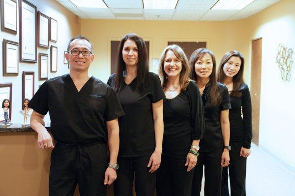 Dr. Paul M. Lee with his staff.