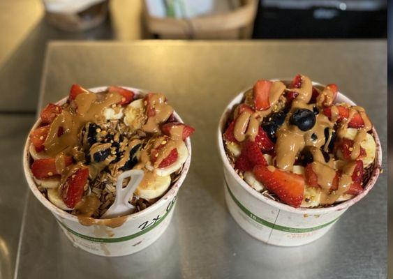 Açaí bowls with peanut butter, honey, strawberries, bananas, granola, and all the goodness.