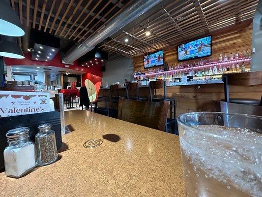 The bar and two tv's from the tables right behind it. Not sure if you could see if someone sits at the bar blocking view on popular nights.