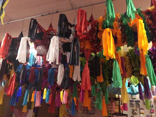 Lots of colorful piñatas.